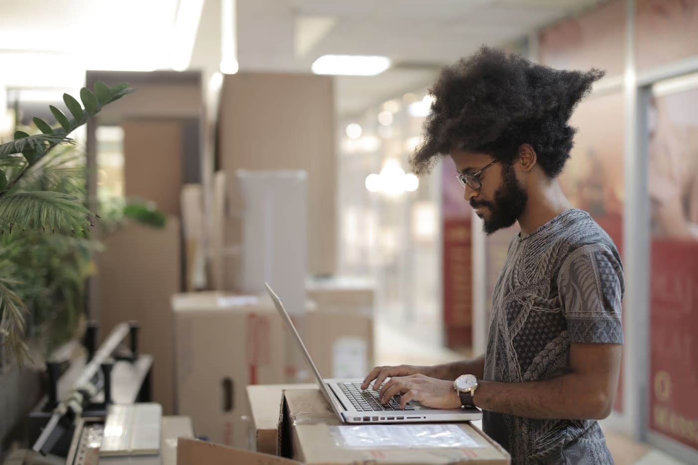 An entrepreneur working on a laptop in a shared workspace